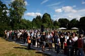 Spectators queue in Wimbledon park ahead of day one of The Championships Wimbledon 2024 at All England Lawn Tennis and Croquet Club on July 01, 2024 in London, England. (Photo by Adam Pretty/Getty Images)