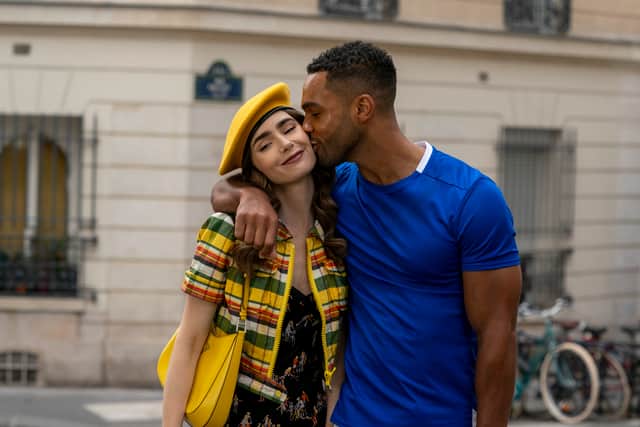 Lily Collins as Emily and Lucien Laviscount as Alfie in Emily in Paris (Photo: Stephanie Branchu/Netflix)