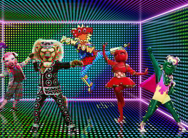Five Masked Dancers - Sea Slug, Pig, Pearly King, Onomatopoeia, Tomato Sauce and Cactus - pose on an electric green soundstage (Credit: ITV)