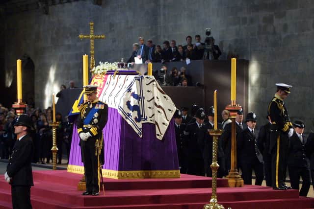 Prince Charles and the Duke of Yor stand vigil beside the Queen Mother’s coffin while it lies-in-state at Westminster Hall in London on 8 April 2002.