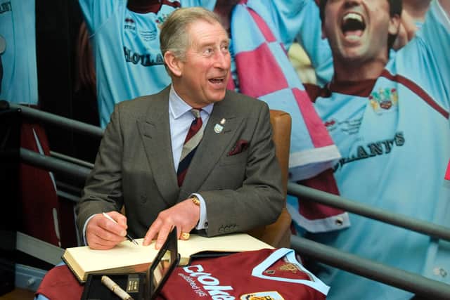 The then Prince Charles meets representatives at Burnley Football Club in 2010