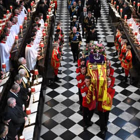 Soldiers of The Queen’s Company of the Grenadier Guards carry the coffin of Queen Elizabeth II