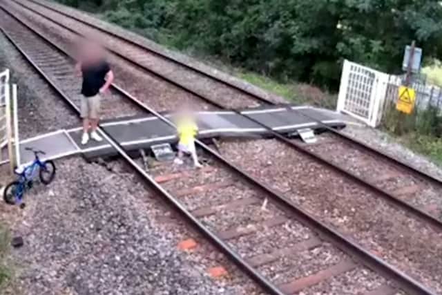CCTV footage released by Network Rail capturing some of the reckless behaviour at a popular level crossing.