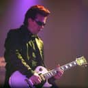 Andy Taylor of Duran Duran performs on stage during the first London date of their UK tour at Wembley Arena on April 13, 2004.  