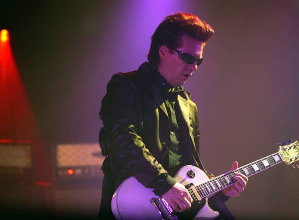 <p>Andy Taylor of Duran Duran performs on stage during the first London date of their UK tour at Wembley Arena on April 13, 2004.  </p>