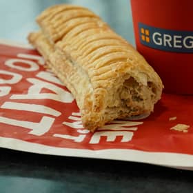 MANCHESTER, ENGLAND - JANUARY 06: In this photo illustration, a Greggs vegan sausage roll lays on a table on January 06, 2019 in Manchester, England. Greggs bakers recently launched the vegan sausage roll to compliment its popular meat sausage roll. The new vegan filling is made out of the company's own bespoke Quorn filling. (Photo Illustration by Christopher Furlong/Getty Images)