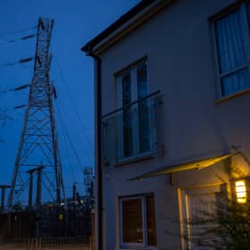 Insulators on an electricity sub station are seen near homes on October 19, 2022 in Manchester, England. The British utility company, National Grid,  have said that UK households may face power cuts this winter for up to three hours at a time, if gas supplies run low. The UK relies heavily on gas to produce electricity, and gas supplies to Europe have been severely disrupted by the fallout from Russia's invasion of Ukraine. (Photo by Christopher Furlong/Getty Images)