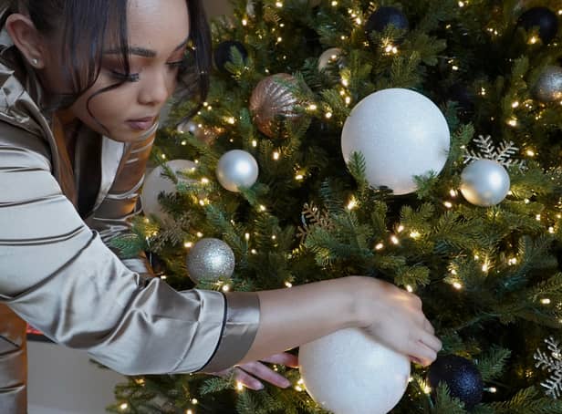 <p>Nia Wells, 29, would hours each day wandering around looking at festive displays in shops - and wished she could make her own decorations look so perfect. The avid Christmas lover realised she could create a full-looking tree just by hanging her baubles differently. </p>