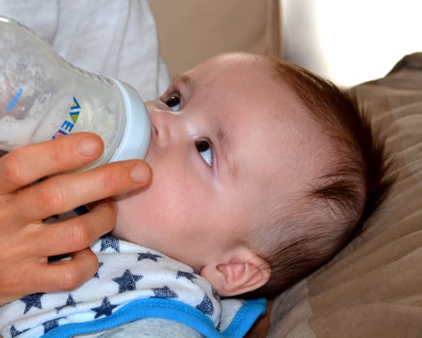A baby drinks formula from a bottle. Pic: Pixabay.