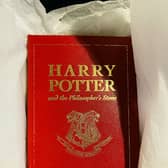 The leather-bound special 15th  anniversary edition of Harry Potter and the Philosophers Stone -  published exclusively for the competition in 2012.