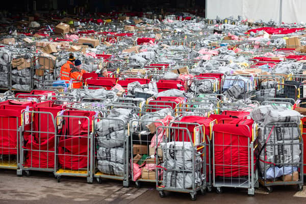 Letter and parcels pile up outside the Royal Mail centre in Bristol. Due to the postal strike along with the busy festive period lots of cages are seen outside the mail centre. Many of these parcels have been left outside for at least 17 hours.