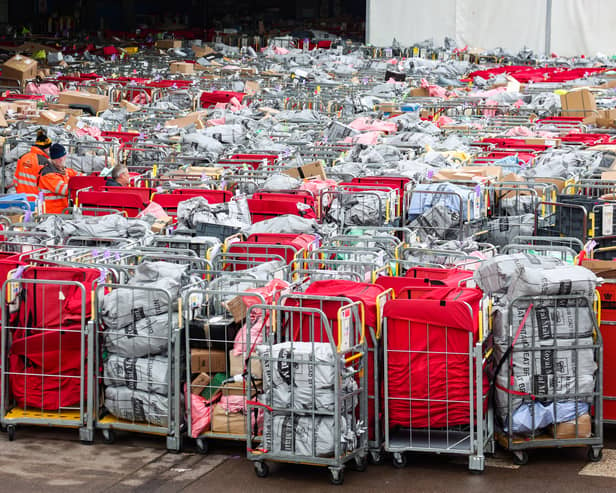 Letter and parcels pile up outside the Royal Mail centre in Bristol. Due to the postal strike along with the busy festive period lots of cages are seen outside the mail centre. Many of these parcels have been left outside for at least 17 hours.