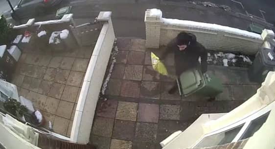 <p>A CCTV camera captured the moment a Christmas parcel was stolen only minutes after an Evri delivery driver bizarrely hid the package under a wheely bin outside the front door. </p>