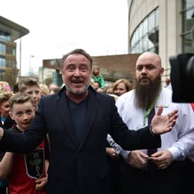 Michael Flatley, star of Riverdance and Lord of the Dance is mobbed by fans as he makes an appearance during the opening day of the World Irish Dancing Championships at the Waterfront Hall on April 10, 2022 in Belfast