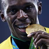 Gold medalist Usain Bolt of Jamaica stands on the podium during the medal ceremony for the Men’s 4 x 100 meter Relay on Day 15 of the Rio 2016 Olympic Games at the Olympic Stadium on August 20, 2016 in Rio de Janeiro, Brazil.  (Photo by Patrick Smith/Getty Images)