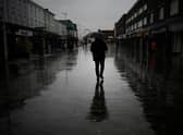 Dismal weather heralds the arrival of the UK Chancellor’s Autumn Statement as people shop in the centre of Bolton.