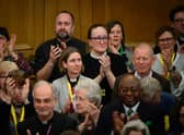 : Members of the General Synod react after blessings for same-sex couples was approved in a vote by the General Synod at The Church House.
