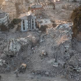 An aerial view of work machines and diggers at the site of collapsed buildings on February 16, 2023 in Hatay, Turkey