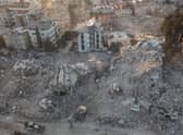 An aerial view of work machines and diggers at the site of collapsed buildings on February 16, 2023 in Hatay, Turkey