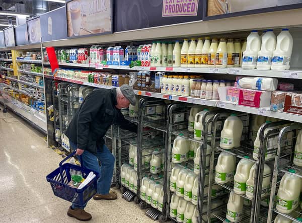 A customer shops for milk inside a Sainsbury's supermarket in east London on February 20, 2023.