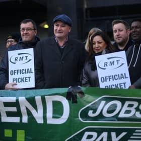 RMT general secretary Mick Lynch (centre) on an RMT picket line during January’s strike (Photo by DANIEL LEAL/AFP via Getty Images)
