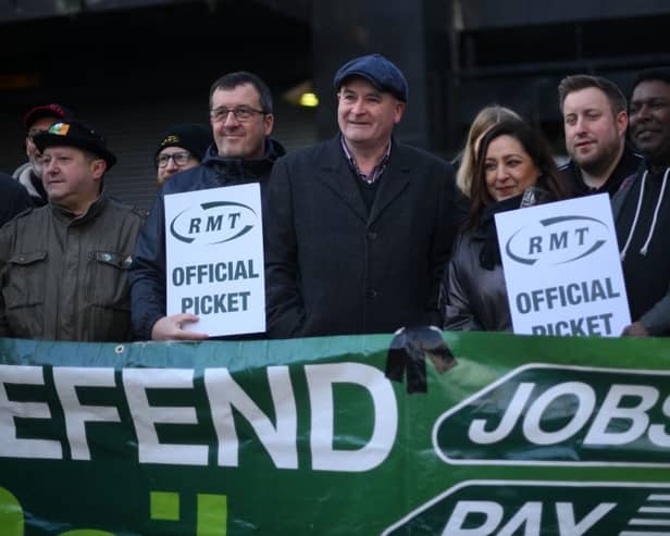 RMT general secretary Mick Lynch (centre) on an RMT picket line during January’s strike (Photo by DANIEL LEAL/AFP via Getty Images)