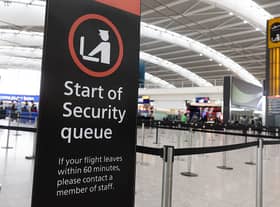 A sign indicating the start of the security queue during a strike by security workers at London Heathrow Airport in London, UK, on Friday, March 31, 2023. IAG SAsÂ British AirwaysÂ is set to scrap 320 flights during the Easter week as security workers strike for 10-days over pay. Photographer: Chris Ratcliffe/Bloomberg via Getty Images