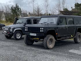 Munro EV, pictured beside a mid-teens Land Rover Defender at Gleneagles Estate