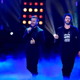 Take That bandmates Mark Owen, Gary Barlow and Howard Donald