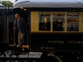 A man disembarks from the Venice Simplon-Orient-Express after arriving at Istanbul Station in Istanbul (Photo by YASIN AKGUL/AFP via Getty Images)