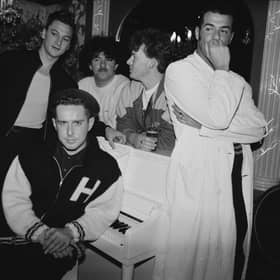 Frankie Goes To Hollywood in 1986. Singer Holly Johnson is seated by the piano, and behind him are (left to right) bassist Mark O’Toole, drummer Peter Gill, guitarist Brian Nash and singer Paul Rutherford. 