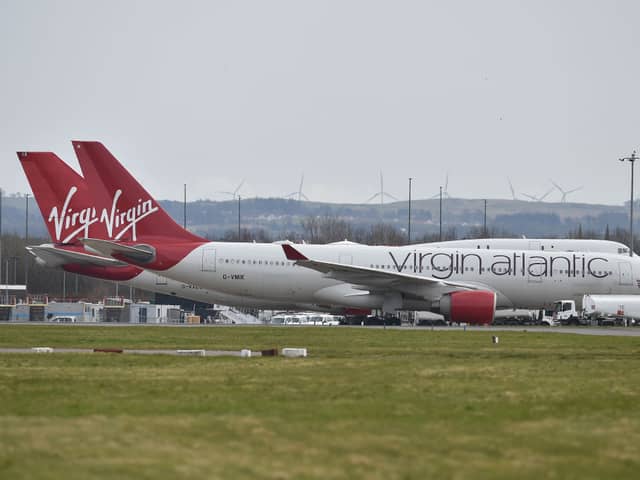 Virgin Atlantic planes sit on the runway at Glasgow Airport.