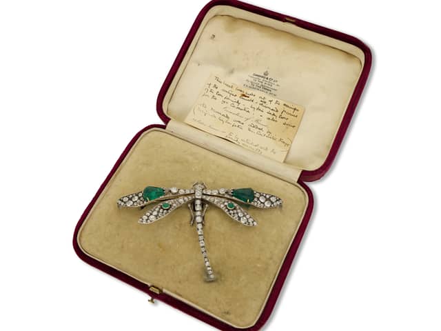 This emerald and diamond dragonfly brooch worn at three royal coronations has gone up for sale at Mayfair’s oldest family jewellers for £350,000.