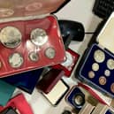 The secret collection, which includes a William III crown dating back to 1696, could fetch in excess of £17,500 at auction.