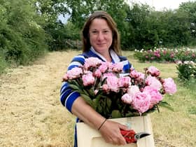 Elonor Tivey at her seven acre field in Leicestershire where she farms peonies. 