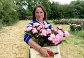 Elonor Tivey at her seven acre field in Leicestershire where she farms peonies. 