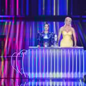 Eurovision hosts Julia Sanina and Hannah Waddingham with the Eurovision trophy