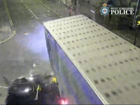 The car is seen smashing into the lorry.