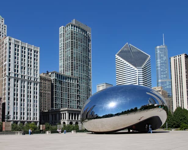 The Cloud Gate sculpture, popularly known as the bean, with Chicago's skyline