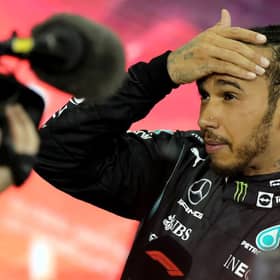 Second-placed Mercedes' British driver Lewis Hamilton reacts in the parc ferme of the Yas Marina Circuit after the Abu Dhabi Formula One Grand Prix on December 12, 2021 (Getty Images)