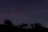 A meteor streaking through the night sky over Myanmar during the Geminid meteor shower in 2018 (Photo: YE AUNG THU/AFP via Getty Images)
