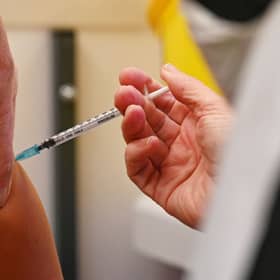 A member of the public receives a dose of the Pfizer BioNtech vaccine at a vaccination centre (Getty Images)