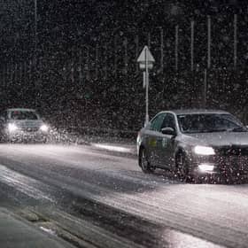Motorists drive through a heavy snow shower as it passes over Saltburn By The Sea as Storm Arwen sweeps across parts of the country on November 26, 2021 (Photo: Getty)