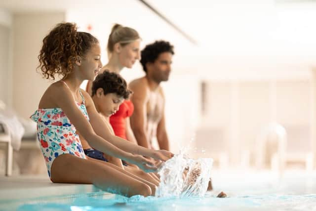 Family at the poolside (photo: Jason Alden)