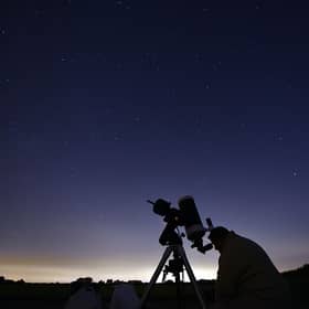 Members of the York Astronomical Society prepare to view the annual Perseids meteor shower in the village of Rufforth, near York, in August 2015 (Photo: OLI SCARFF/AFP via Getty Images)