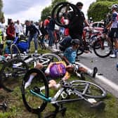 The entire pelaton came crashing down after a spectator reached out into the road with a placard (Photo: Getty Images)
