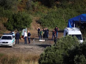 Portuguese Judicial Police criminal investigation unit members prepare at the base camp near the Arade dam, in Silves, on 24 May, 2023 on the second day of a new search operation amid the investigation into the disappearance of Madeleine McCann. (Photo by FILIPE AMORIM / AFP) (Photo by FILIPE AMORIM/AFP via Getty Images)