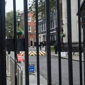 A car has crashed into the gates leading to the British government buildings on Downing Street 