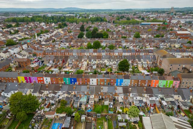 Tasha Frootko and partner Stuart Doust have transformed a street by painting the houses bright colours in Gloucester.