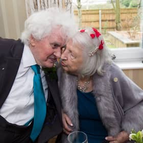 Joan Neininger & Ken Selway share a kiss at their wedding reception at Hannover Court, Cinderford, Gloucestershire. 